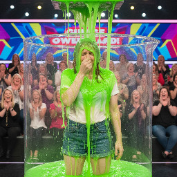 Bryce Dallas Howard holding her nose as she is covered in some smelly slime