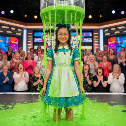 A young teen east asian girl with glasses with thin small frames. She is dressed with the dress and hair bow of alice in wonderland, and has a shy smile. Photorealistic.