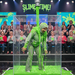 19 year old girl with light grey hijab and glasses light grey hoodie grey flair pants white sneakers