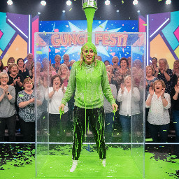 30 year old woman blond hair small body with light grey and hoodie strings tied together black sport pants and white socks